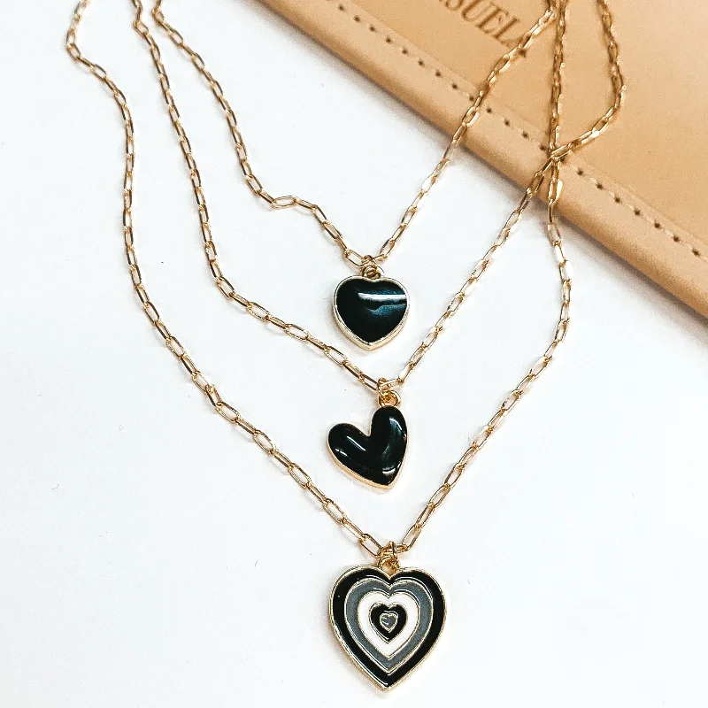 Three Strand Gold Multi Chain Necklace with Black and White Heart Charms